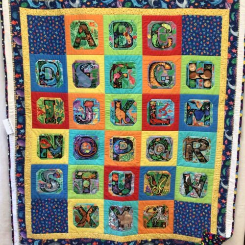 Child's Alphabet panel quilt featuring colorful animals for each letter
