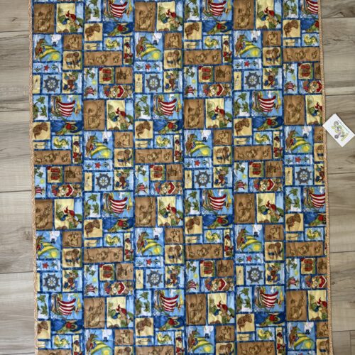 Baby quilt with pirate-themed scenes featuring teddy bear pirates, treasure maps, ships, treasure chests, and tropical islands with blue sashing