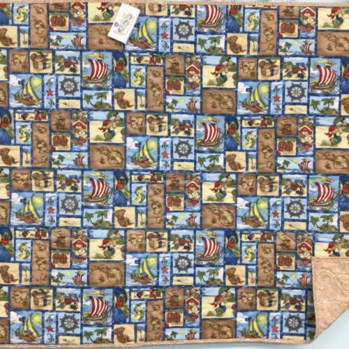 Baby quilt with pirate-themed scenes featuring teddy bear pirates, treasure maps, ships, treasure chests, and tropical islands with blue sashing